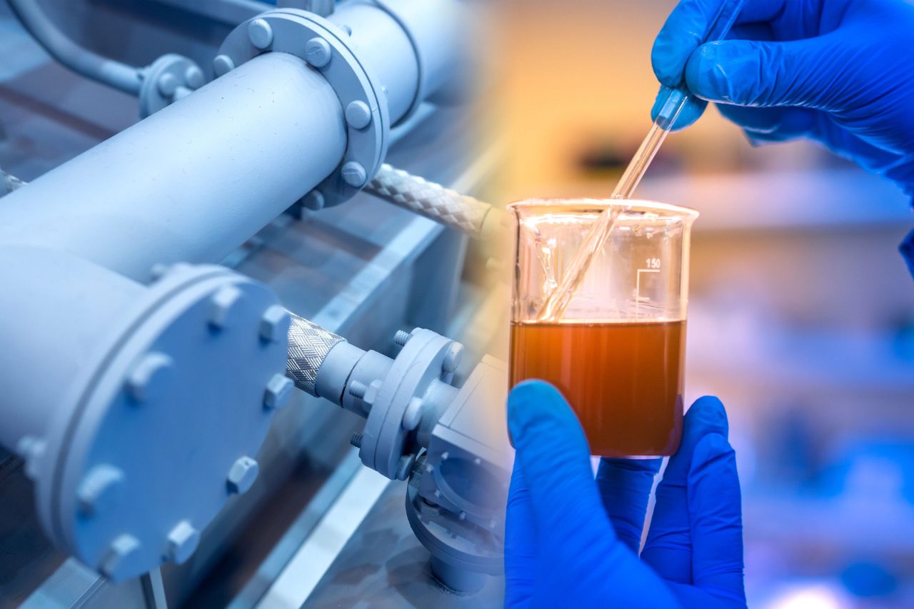 Chemical analysis at the enterprise. The job of a chemist in the workplace. The hands of the laboratory assistant hold the container with the sample of the substance.