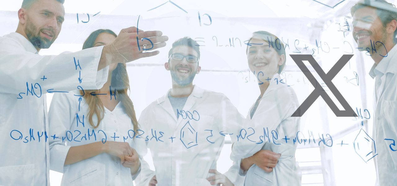 group of laboratory scientists discussing their research in the
