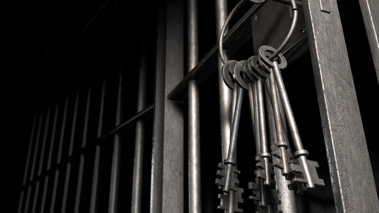 Keys hanging on prison bars in a prison.