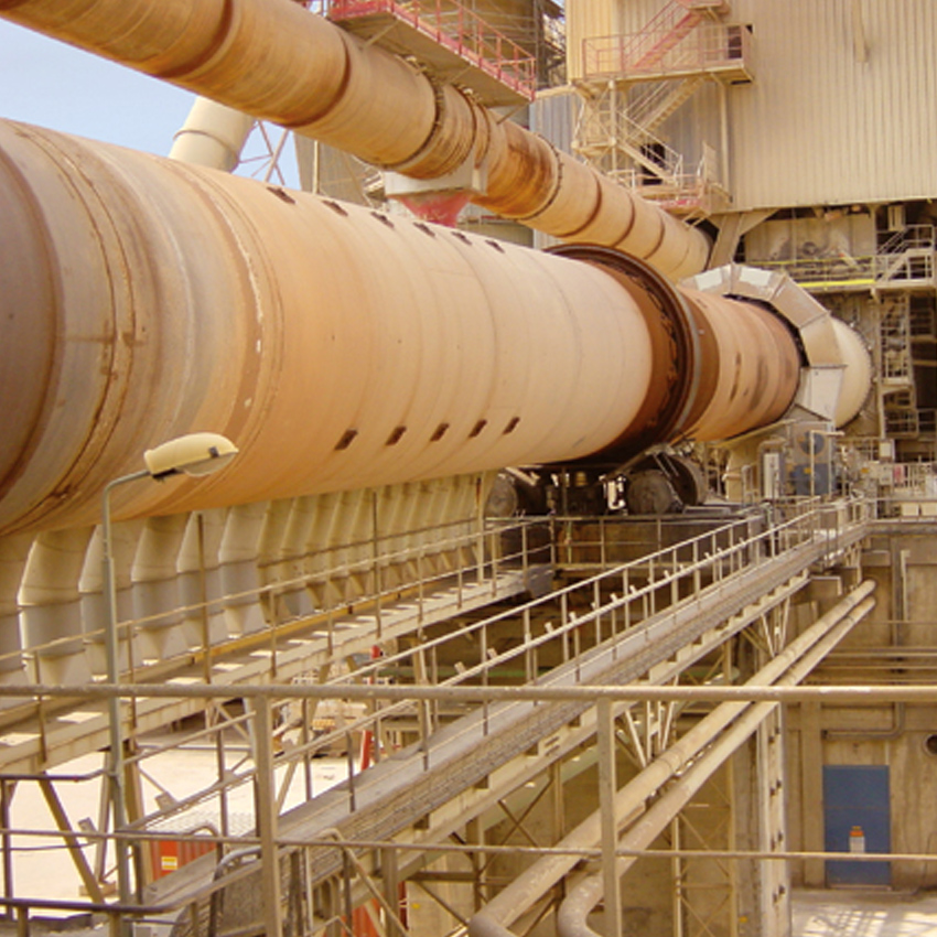 Large industrial system with metal walkways and structural supports at a processing facility.