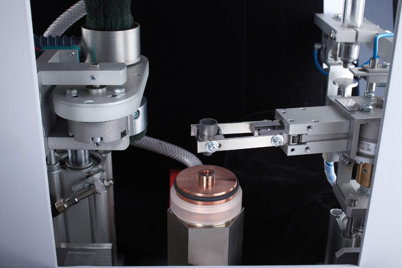 Automated crucible handling with electrode cleaning