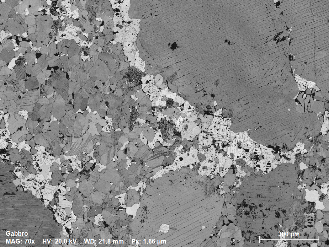 Orientation contrast image acquired with ARGUS imaging detector. It reveals the microstructure and despite some curtaining from the ion milling, the sample is well prepared: internal strain in the gold bond is clearly visible by color-coded orientation contrast.