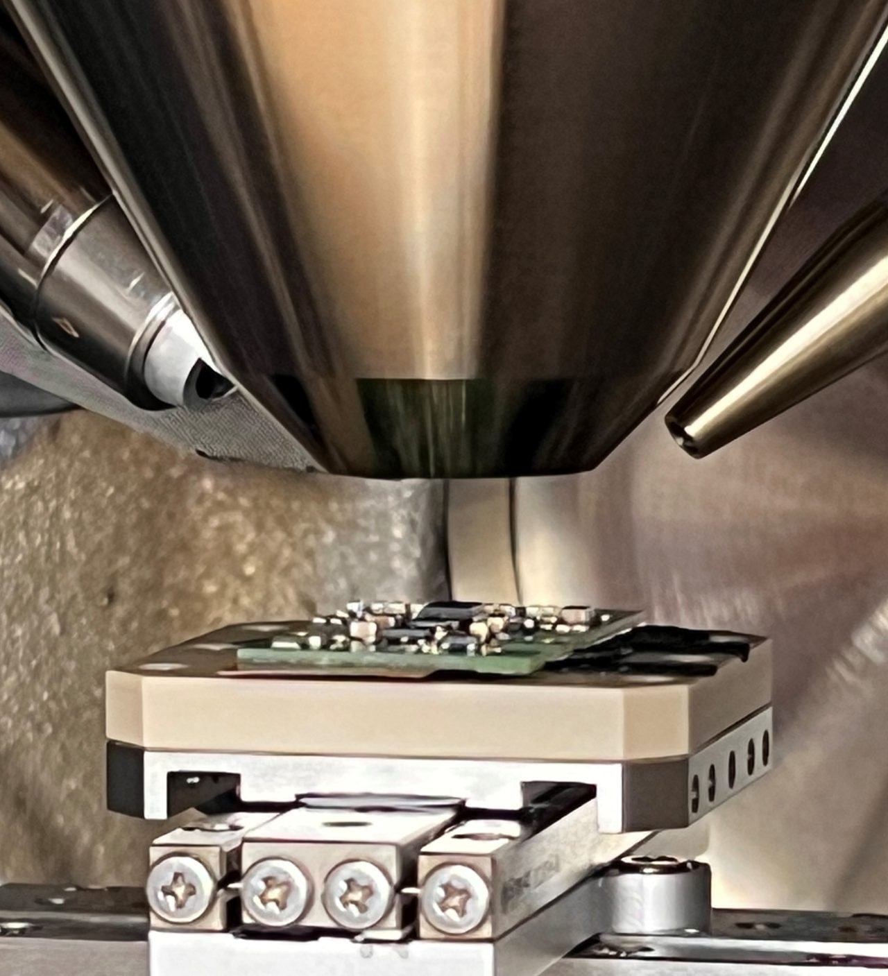 Image of the inside of a SEM with an EDS detector and X-ray source for micro-XRF analysis