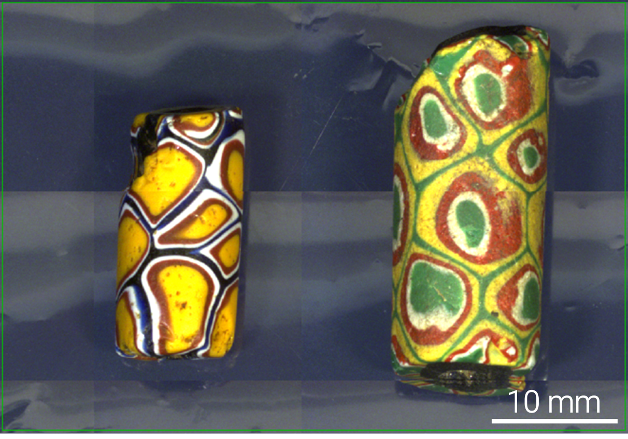 Optical image of two highly-decorated, coloured glass beads