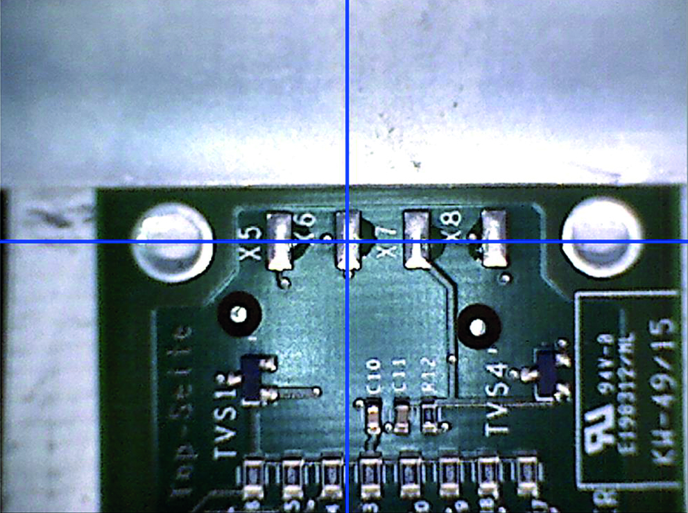 Image taken with the Laser-Video microscope. The cross-hair indicates the measurement position at solder bond X6.