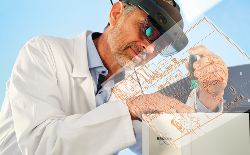 Image showing a technician using VR goggles to maintain the S8 TIGER WDXRF spectrometer. The goggles are showing him where to fix