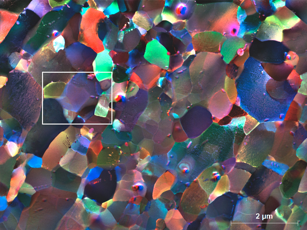 Color coded dark field image acquired from a heavily deformed (ARB) Al alloy sample. The highlighted area shows 3D details. The position and inclination of the boundary plane between grains is visible through the sample thickness.