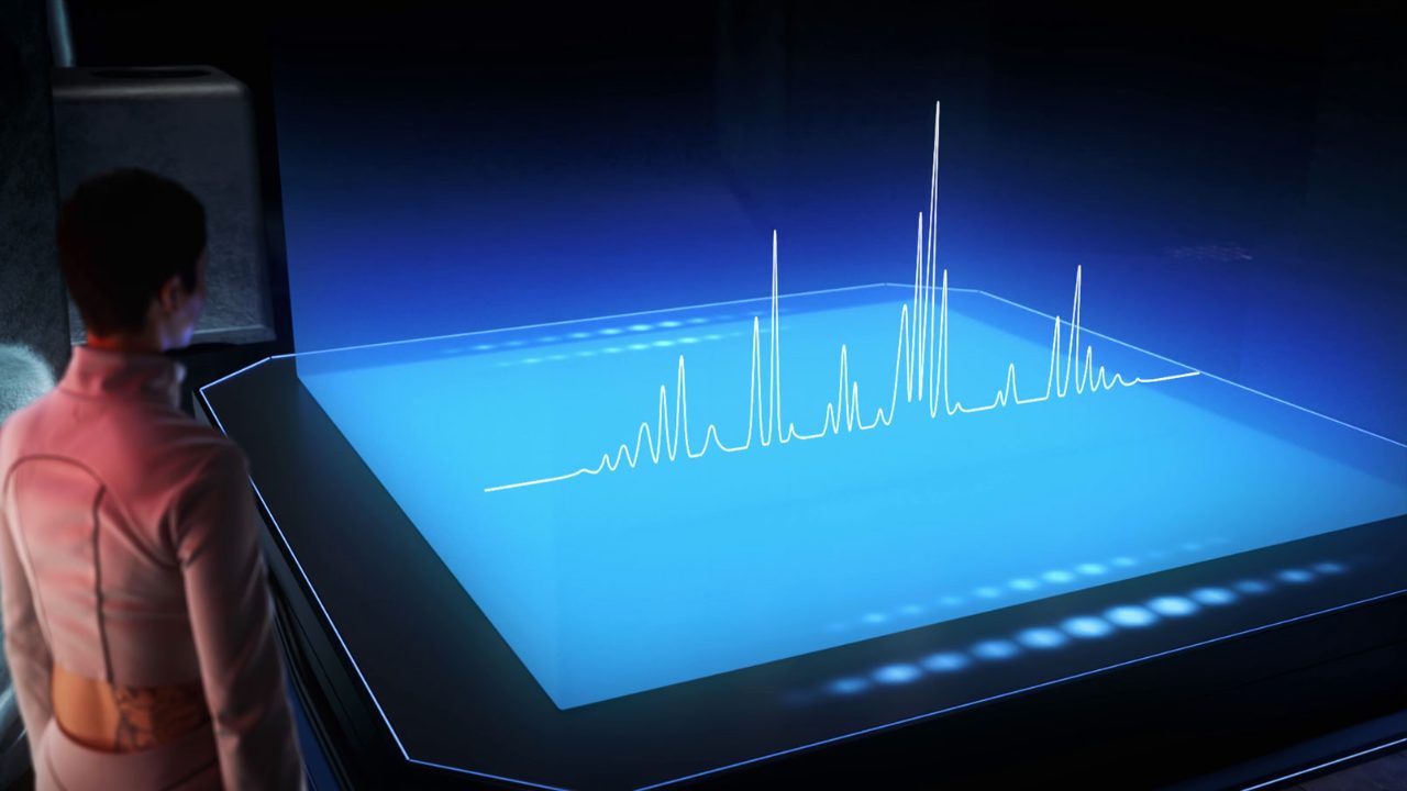 A woman is looking at a horizontal display. Spectra protrude from the display.